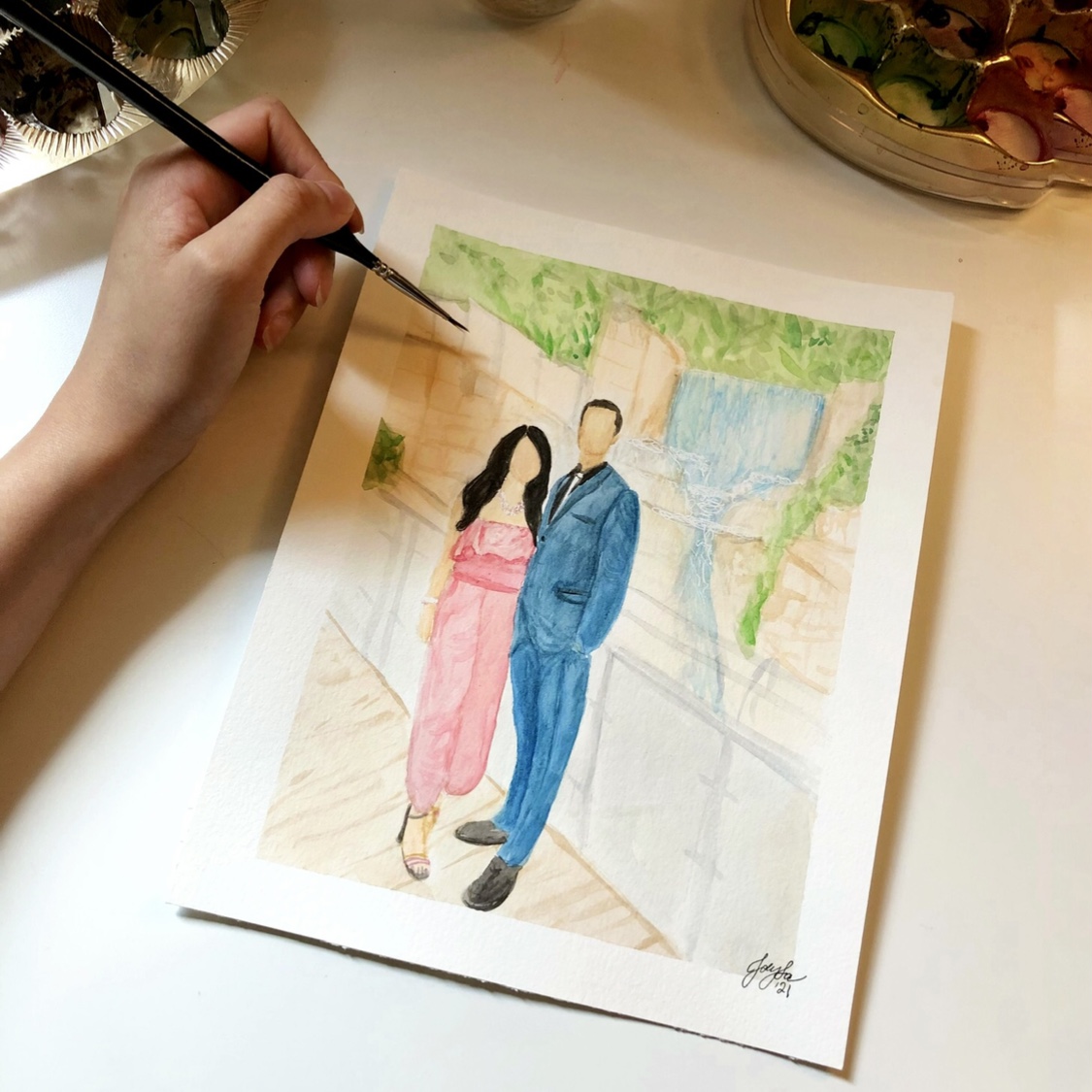 watercolour portrait of a couple in front of a waterfall